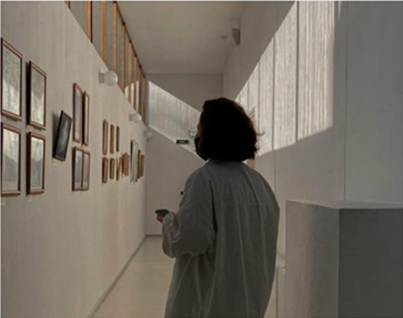 Person walking in gallery